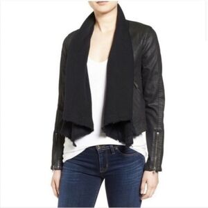 This is a Free People Coated Denim & Sweater Zip Cuff Multi Styled Moto Jacket. 